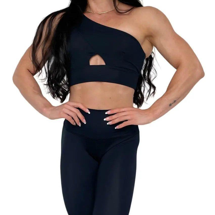 Mujer vistiendo los leggings compresivos de cintura alta Legging Myself de LUXFEEL en color Negro, que ofrecen un efecto segunda piel.