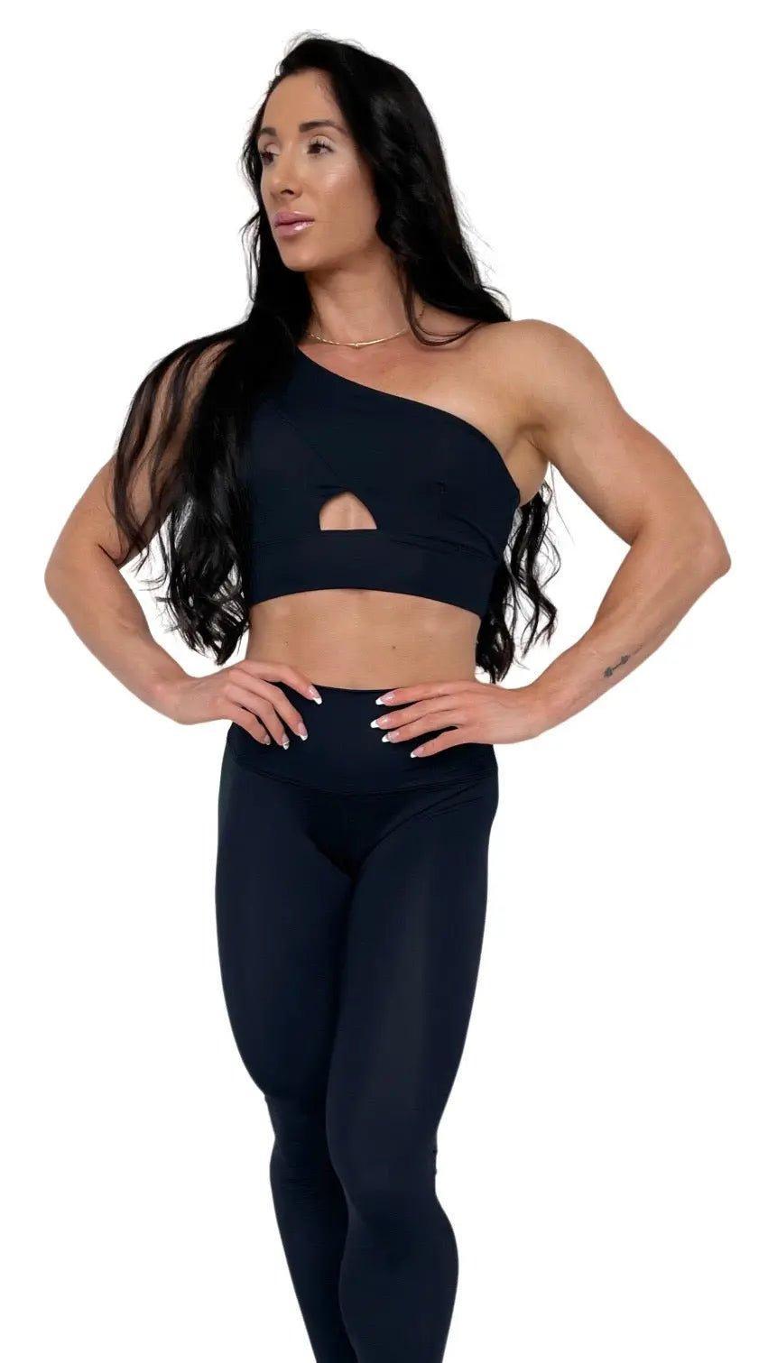 Mujer vistiendo los leggings compresivos de cintura alta Legging Myself de LUXFEEL en color Negro, que ofrecen un efecto segunda piel.