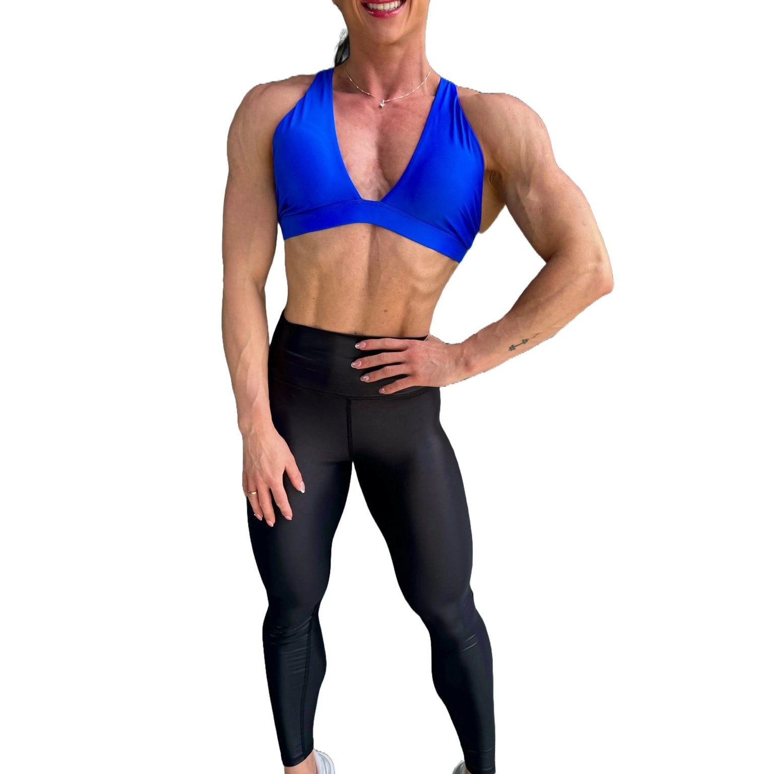 Mujer vistiendo los leggings brillantes de cintura alta Legging Pearl Shine de LUXFEEL en color Negro Brillante, con acabado efecto perla.