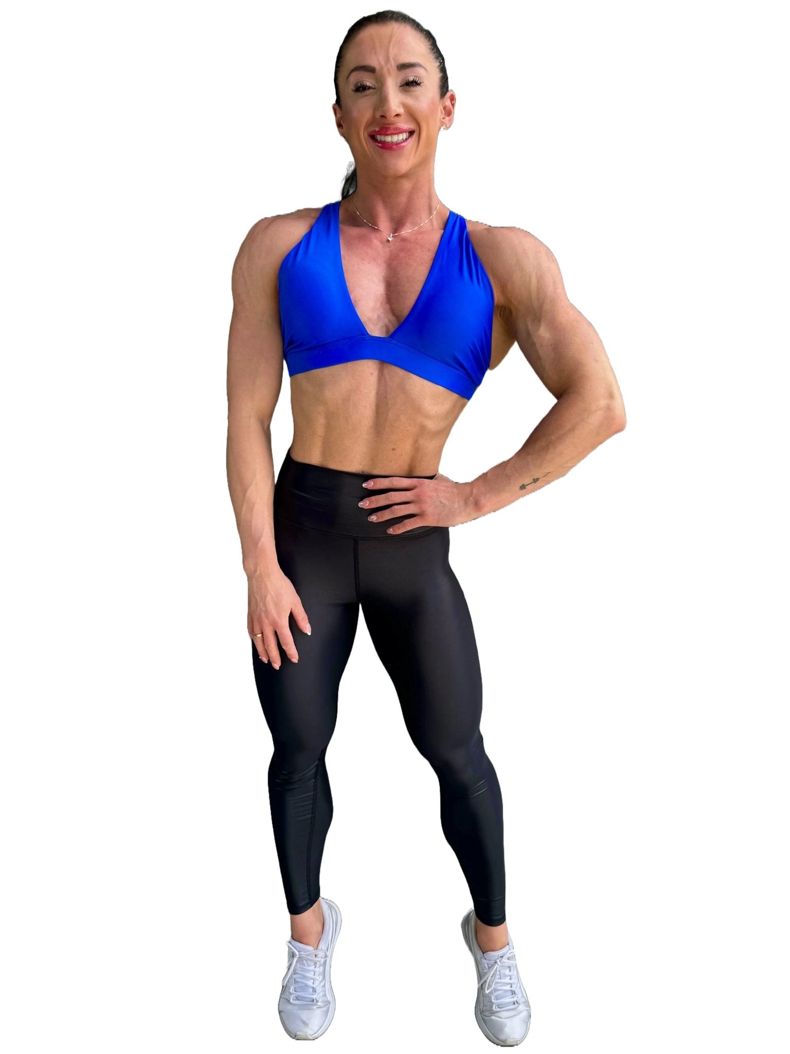 Mujer vistiendo los leggings brillantes de cintura alta Legging Pearl Shine de LUXFEEL en color Negro Brillante, con acabado efecto perla.